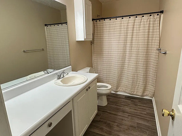 Master bathroom with large shower stall and built-in seat