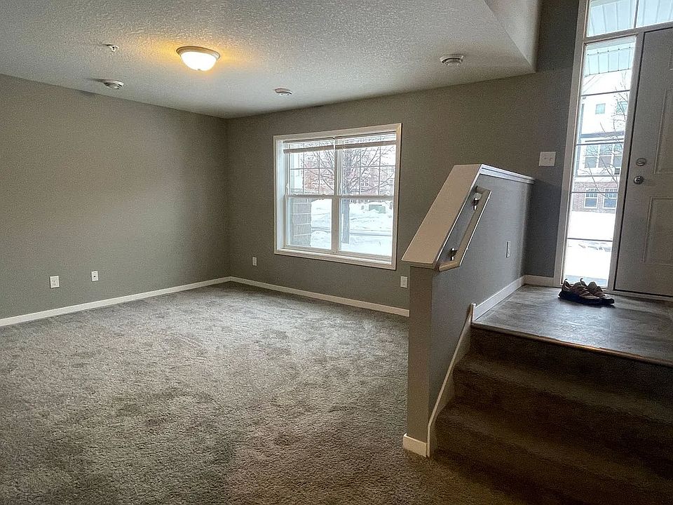 Introducing a spacious and inviting living area at LS Capital Group, featuring plush carpeting and abundant natural light. This versatile space is perfect for relaxing and entertaining. Don't miss outAaaschedule your tour today!