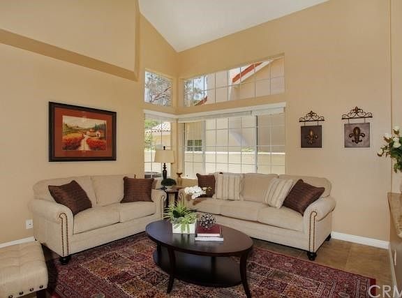 Light filled, vaulted ceiling living room with granite accents.