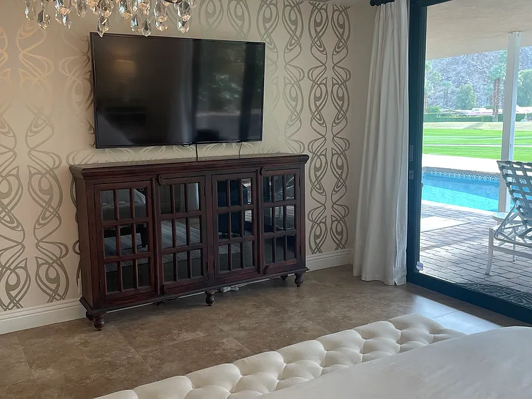 Primary bedroom with pool/mountains/golf views.
