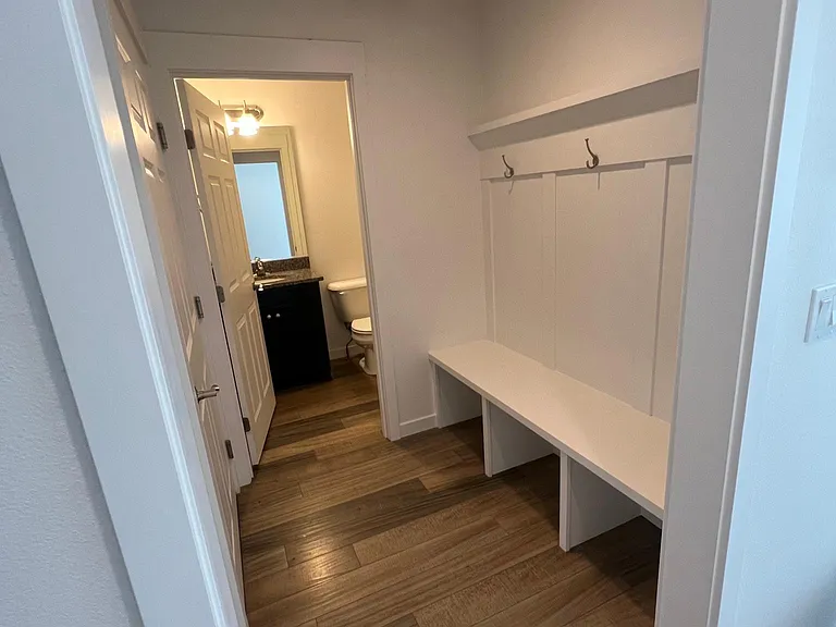 Off of entry (garage on left, 1/2 bath)