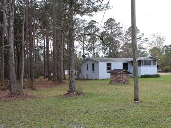 Wooded area behind home