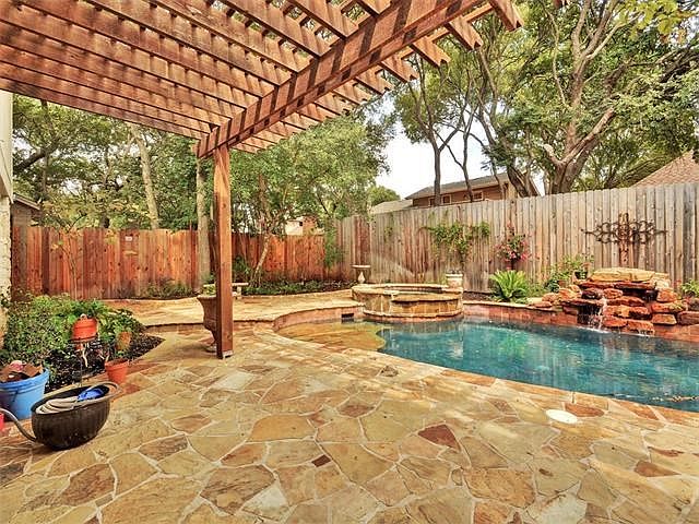 Relax in the shade under the large pergola.