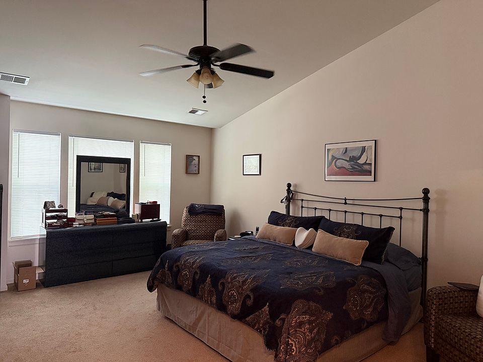 Massive primary suite oasis featuring a private luxury bath with a deep jacuzzi soaking tub.