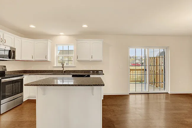White kitchen with stainless steel appliances