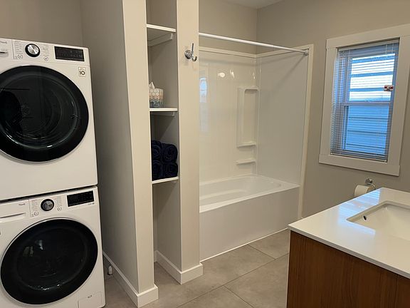 Brand new, large bathroom with brand new energy-efficient washer and dryer.