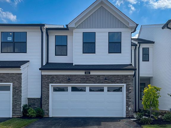 Exterior: 2-Car Garage and Space for Additional 2 Cars on Drive Way