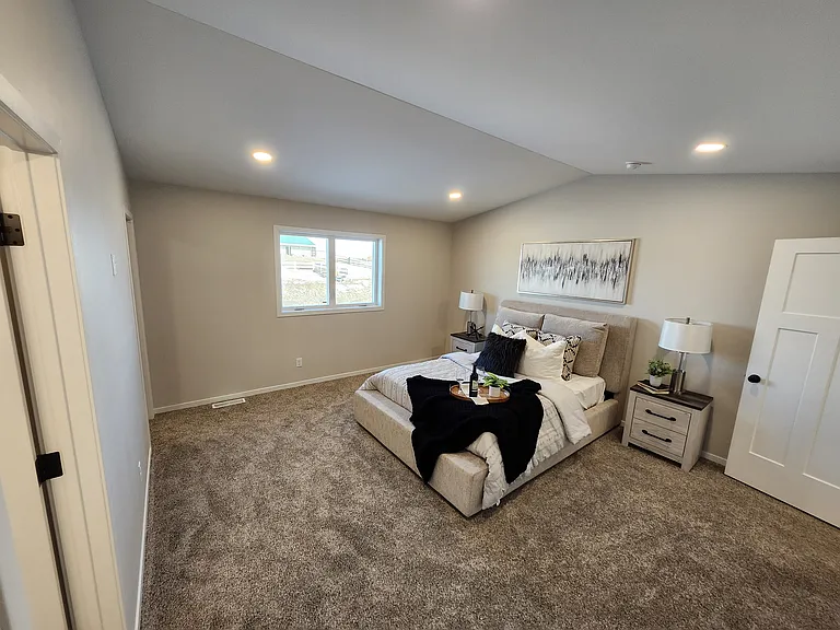 Extra large primary bedroom. (Pictures are of another unit with similar finishes and features.)