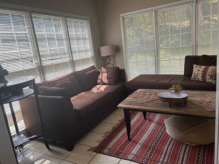 Bright, relaxing living room furnished ( optional) and move in ready! A mud room available in the first level.