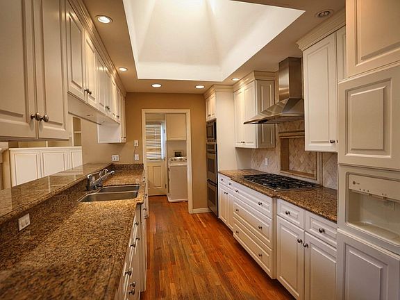 Kitchen with dual ovens, five-burner cooktop and lots of storage.