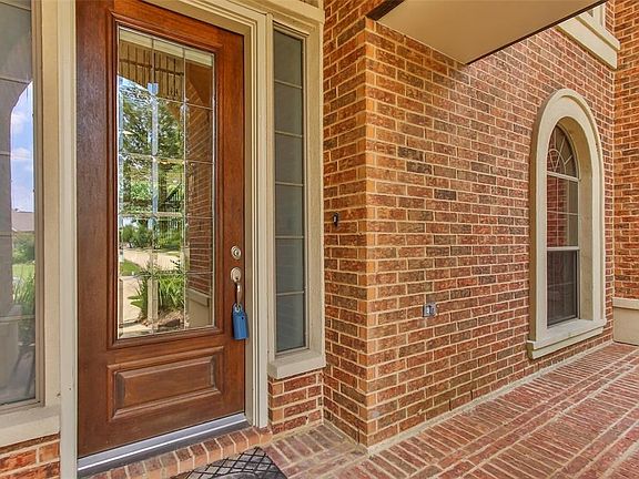 The entry of the home offers beautiful wood and glass door with additional glass window for plenty of natural light in the home. Additionally there is a small porch to enjoy some fresh air as you wait for your friends and family to come see your new home.