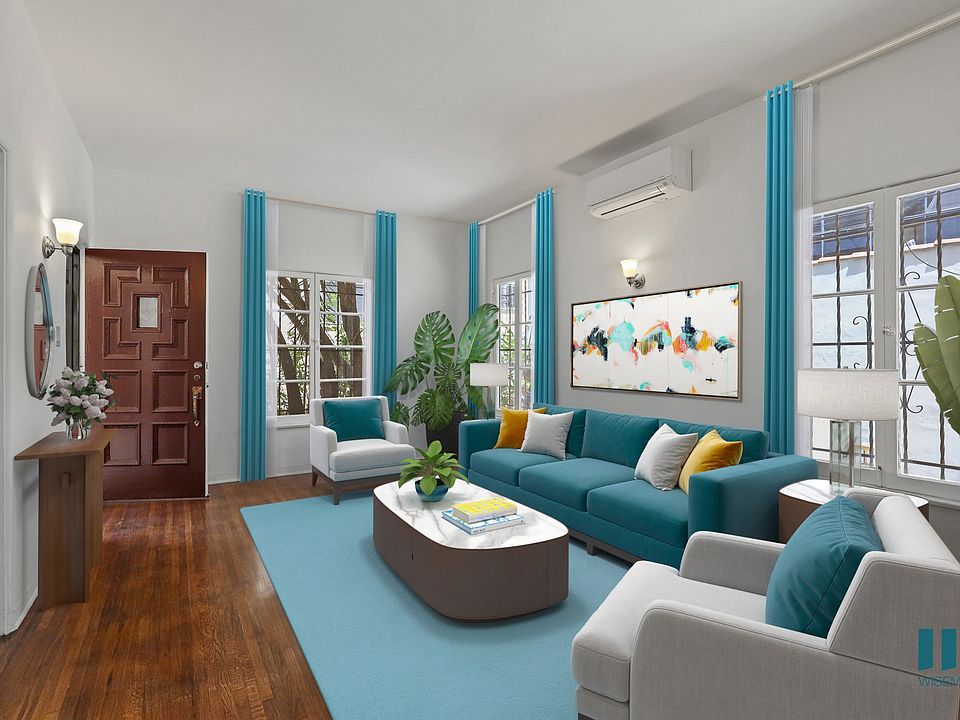 Living Room with Hardwood Floors and Large-Size Windows