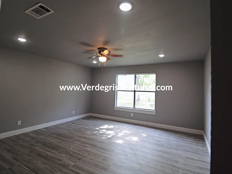 Bedroom 2: This bedroom is generously sized and bright, offering abundant natural light, a comfortable closet, and a ceiling fan for added comfort