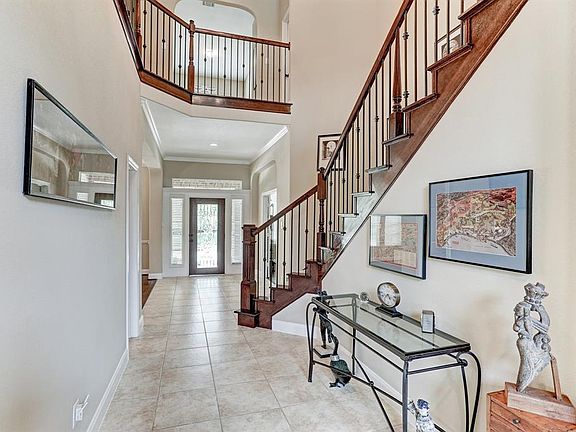 Upon entering the inviting etched glass/wood front door you will find yourself in a grand tile foyer with elegant stairway.