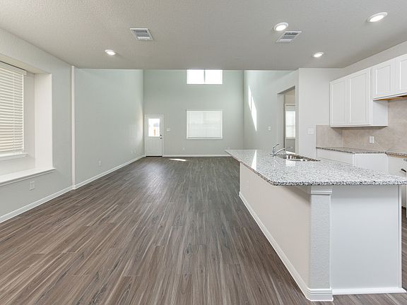 Dining Area and Kitchen to Family Room