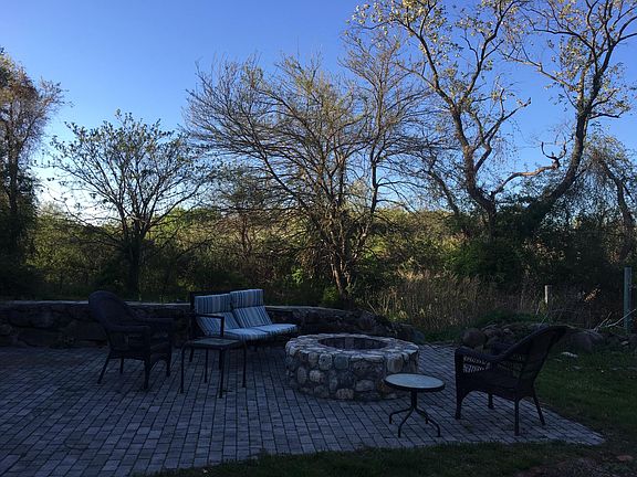Backyard patio with stone firepit