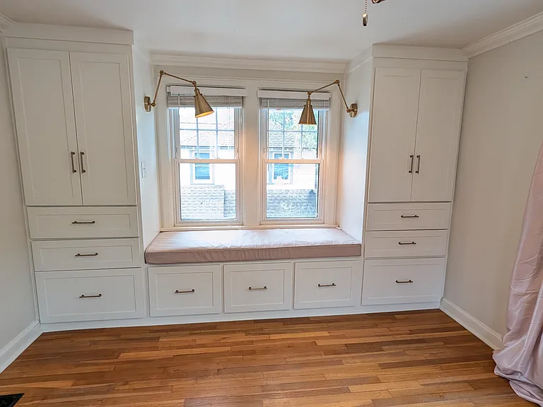 reading lights adorn the custom built-in cabinetry. Extra deep shelves to hang clothes and store extras.