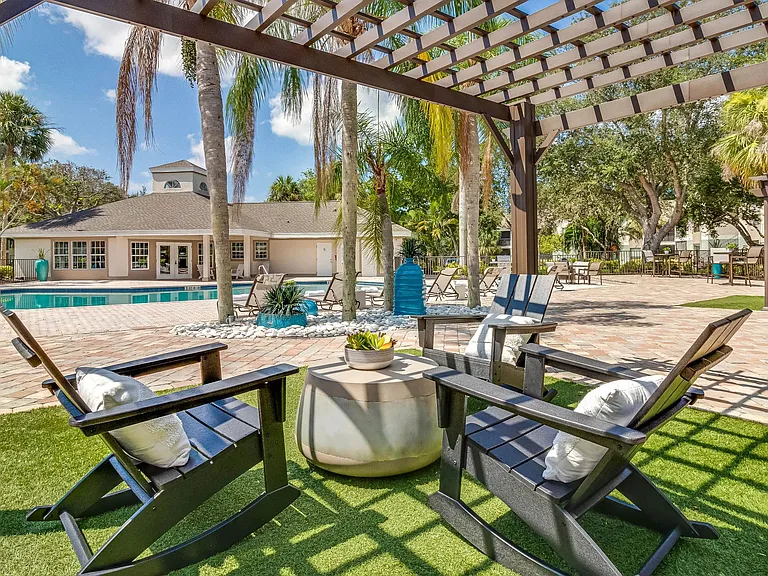 Discover solace beneath our poolside pergolas on the deck.