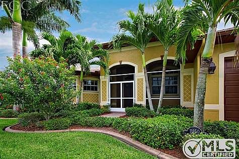 New landscaping in 2012 created a low maintenance yet lovely tropical look.  Many mature palms, too. Freshly painted not too long ago.