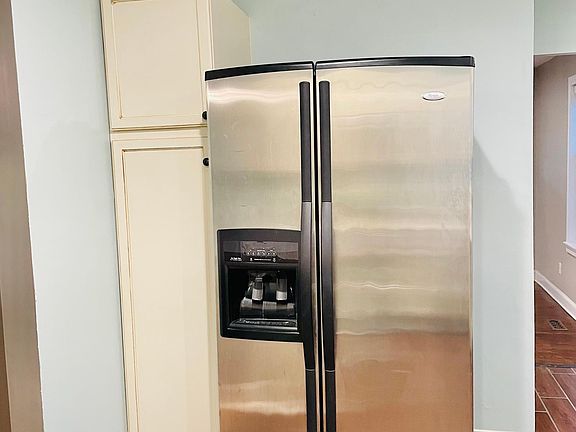 Large fridge with Pantry to the left
