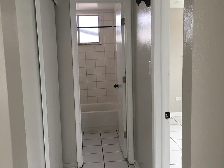 hallway to bathroom and bedroom