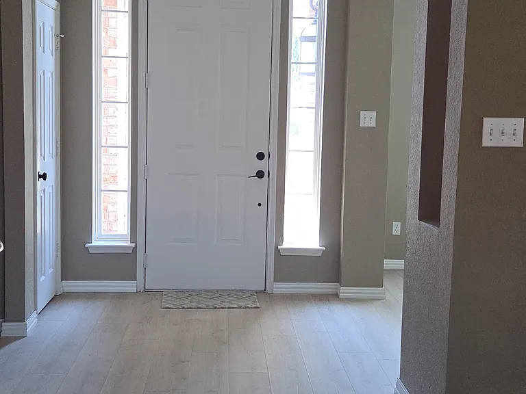 View of front door from family room