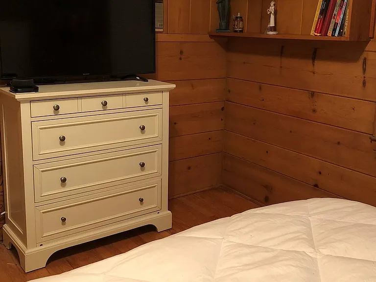 Knotty Pine bedroom with TV