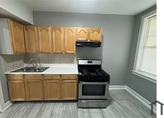 7736 S Colfax Ave — Photo 2