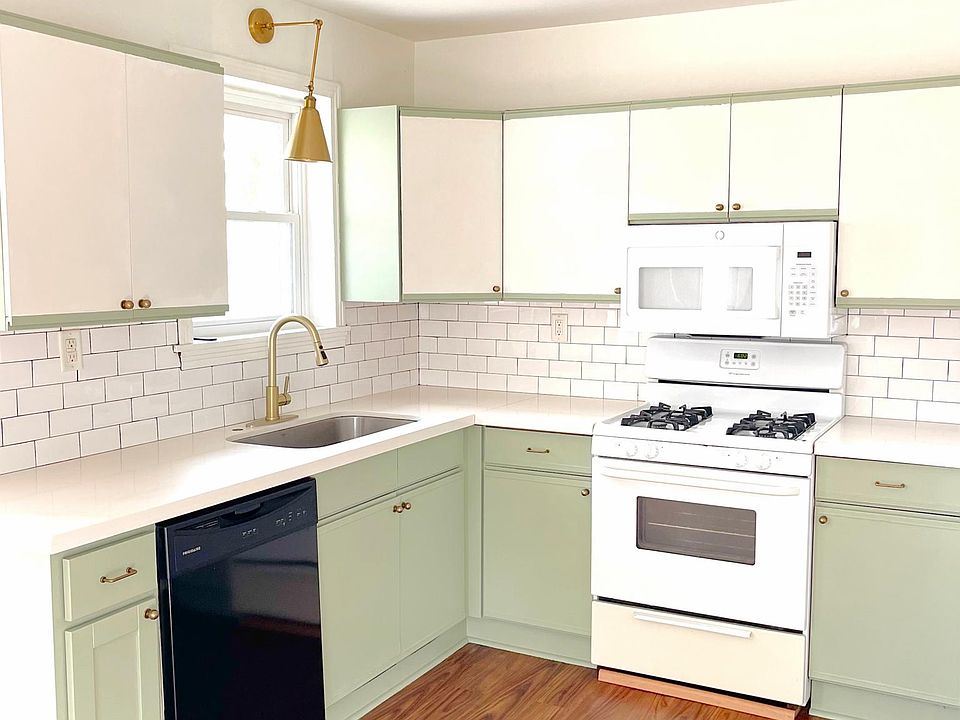 Dishwasher and large farm sink in kitchen