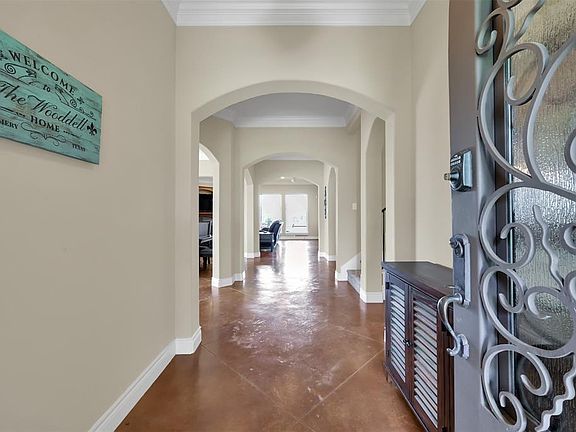 Enter through this Decorative Iron Trimmed front door with Privacy Glass