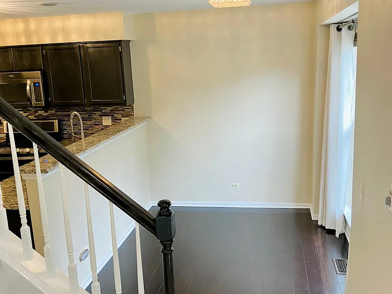 Natural lighting in the dining room , open to the kitchen , hardwood floors