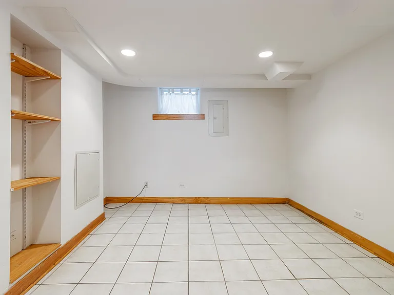 Another bedroom or a great office space/exercise room/guest room! All wood trim, closet and doors plus built-in shelves. Recessed lighting. Quarry Tile Flooring