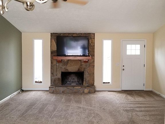 Living room with real wood burning fireplace