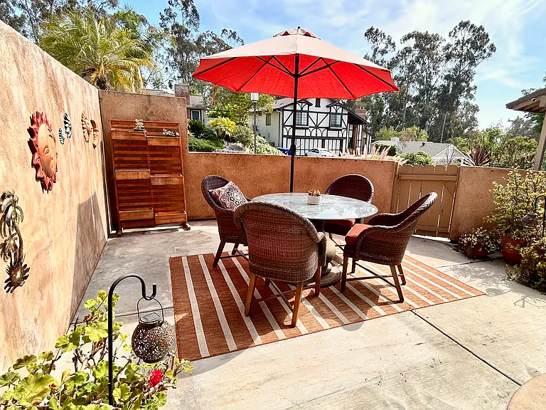 Gated front patio with outdoor dining