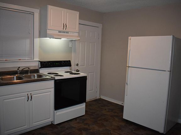 New Cabinets and flooring with a door that walks out to the deck