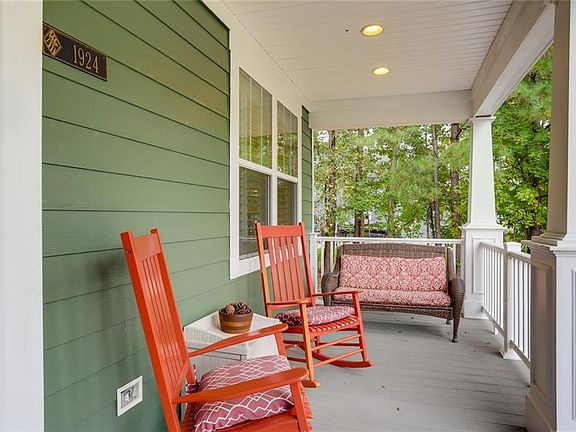 Spacious Front Porch with overhead recessed lights. - Sythetic decking and vinyl rails 