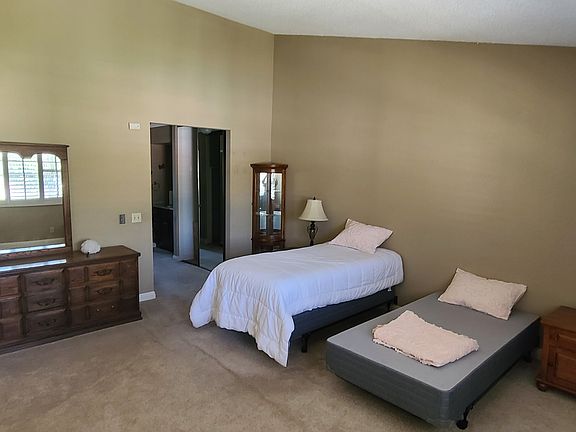 View of the Master Bedroom (queen bed not shown, sorry) with walk-in closets in the background