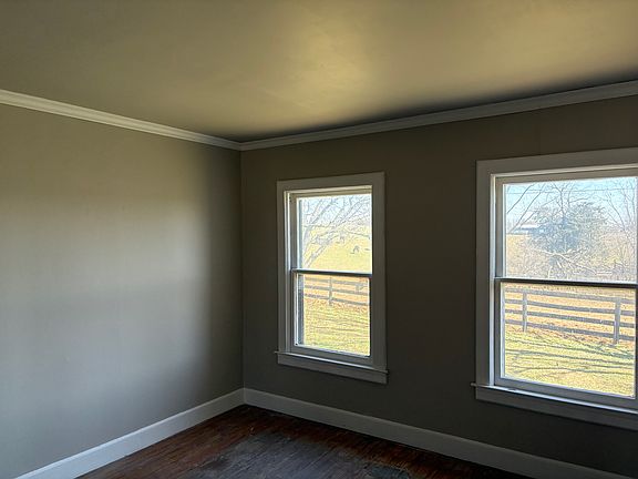 Bedroom with view of horses