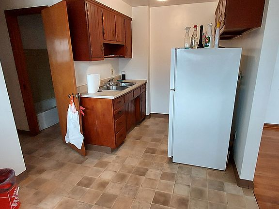 Kitchen, dining area. Stove and fridge in unit for tenant use. Apartment has been cleaned top to bottom.