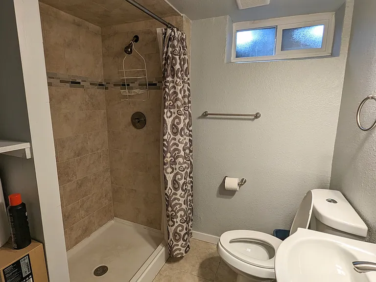 Basement bathroom with extra large shower.