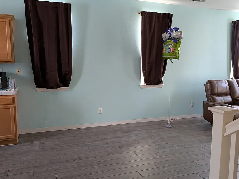 New Floors Living room. Wall paint color is new white.