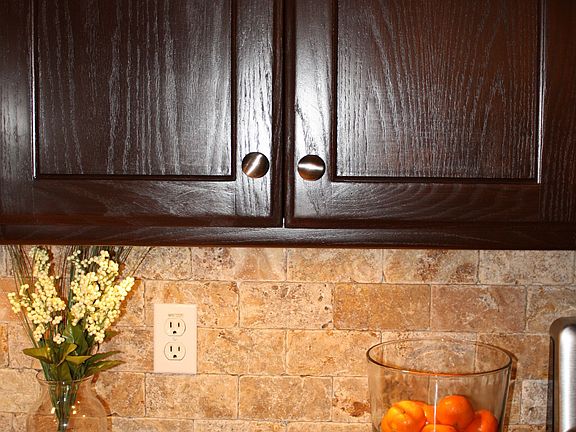 Refinished cupboards, granite countertops, backsplash