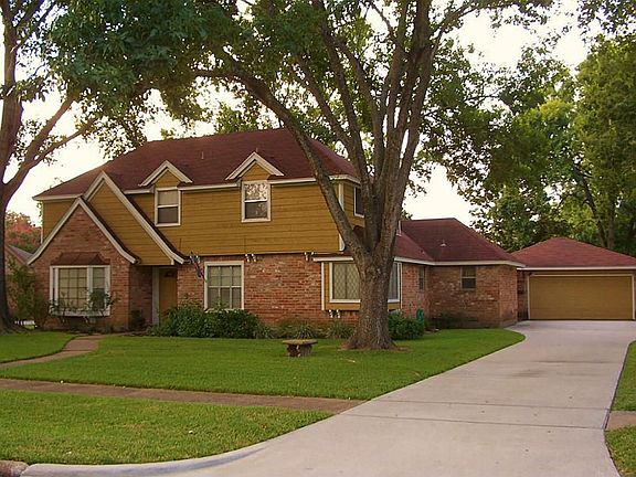 LONG DRIVEWAY THAT HAS BEEN REPLACED.THE PROPERTY HAS A TWO CAR DETACHED GARAGE.