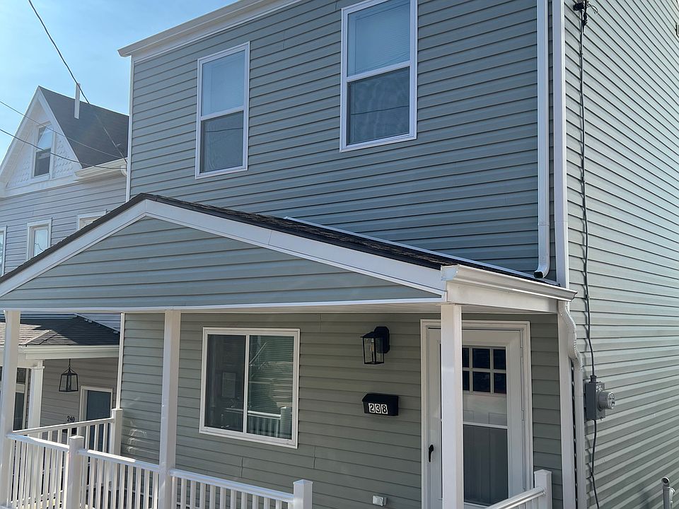 Front of house- BRAND NEW exterior (i.e siding, roof, gutters, windows, doors, railings, etc.) Street view - Front porch
