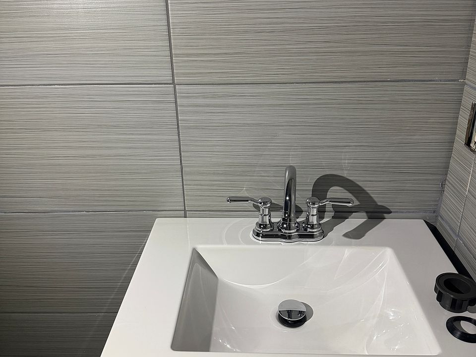 12x24 porcelain tile on all 4 walls of bathroom.