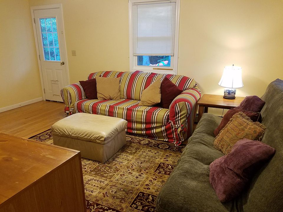 Living room with back door onto small deck