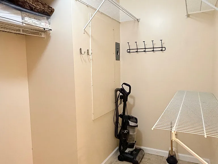 One side of HUGE Primary walk-in closet!