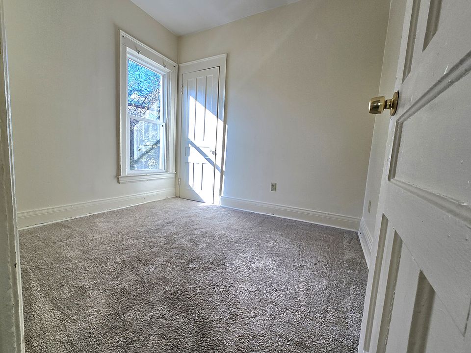 Inviting mid-sized bedroom with a window providing natural light and a spacious closet to keep things organized
