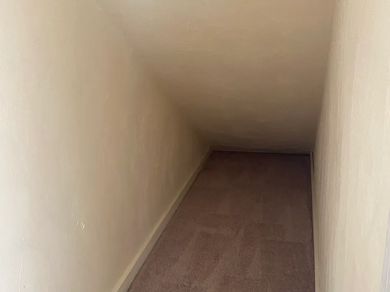 Second bedroom closet under stairs - great storage!!