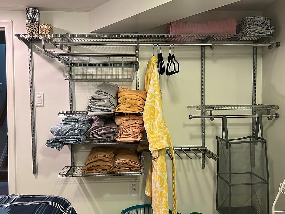 Plush queen bedroom wall closet unit.